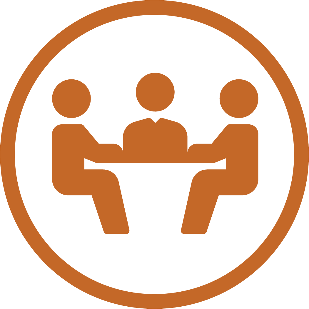 Meeting icon showing three figures seated at desk