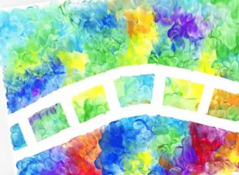 A paper painted with using your finger with various colors. 