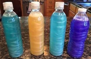 Colorful fluid filled water bottles.